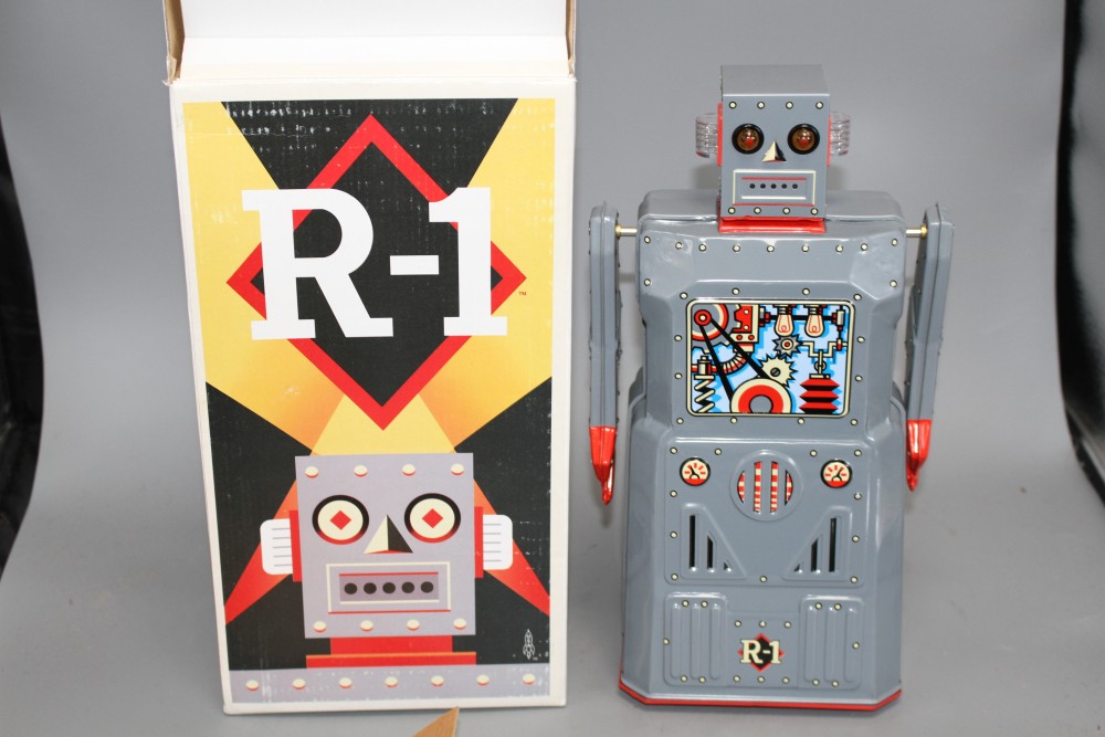 Four collectors robots, various, including a Rocket Toys R-1, two battery-operated ME 100 Space Walk Man (one black, one blue) and a